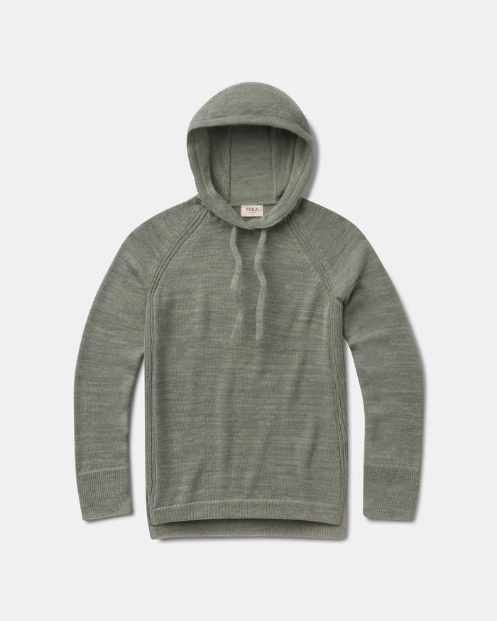 Flat lay of women’s lightweight alpaca hoodie showing hood with drawstrings, raglan sleeves and ribbed cuffs on a light gray background