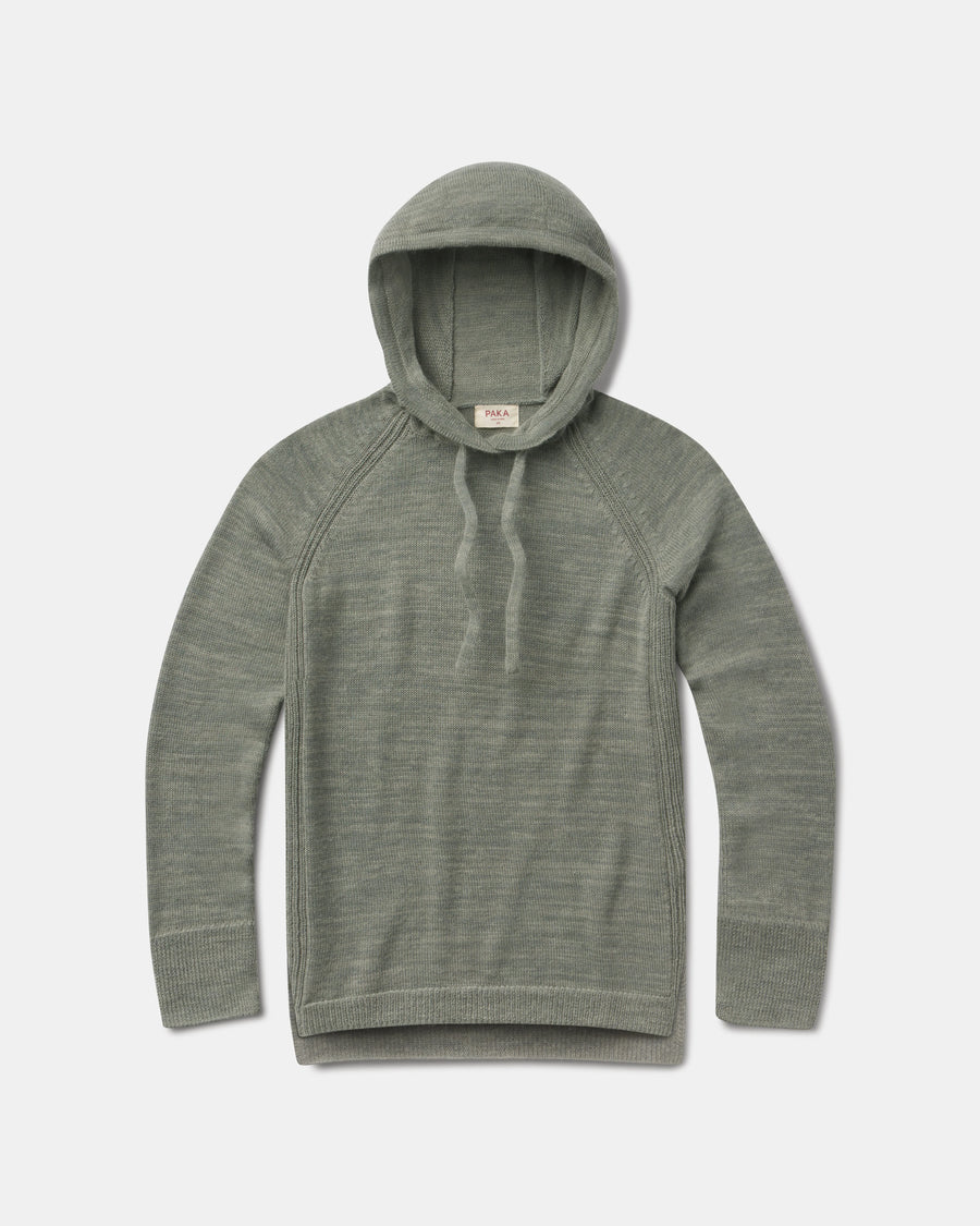 Flat lay of women’s lightweight alpaca hoodie showing hood with drawstrings, raglan sleeves and ribbed cuffs on a light gray background