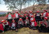 A group of smiling weavers in Patabamba, Cusco