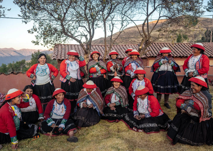 A group of smiling weavers in Patabamba, Cusco