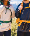 Two backpackers wearing The Hoodie in the nature. The one on the left has alight grey Hoodie, while the one on the right, a charcoal one. 