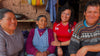 PAKA team with Peruvian scholarship recipients smiling together outside in a village setting