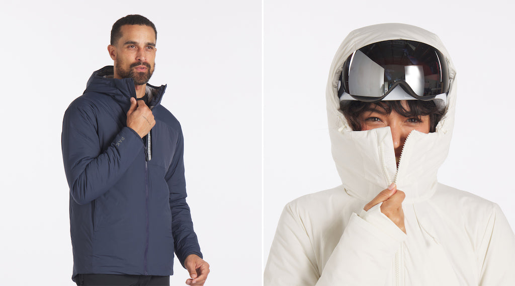Two models in PAKA outerwear: man in navy pullover looking right; person in off‑white insulated jacket with helmet
