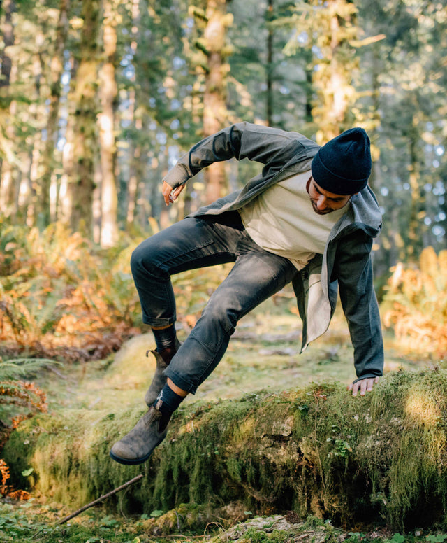 A man crossing the jungle in his alpaca Crew socks