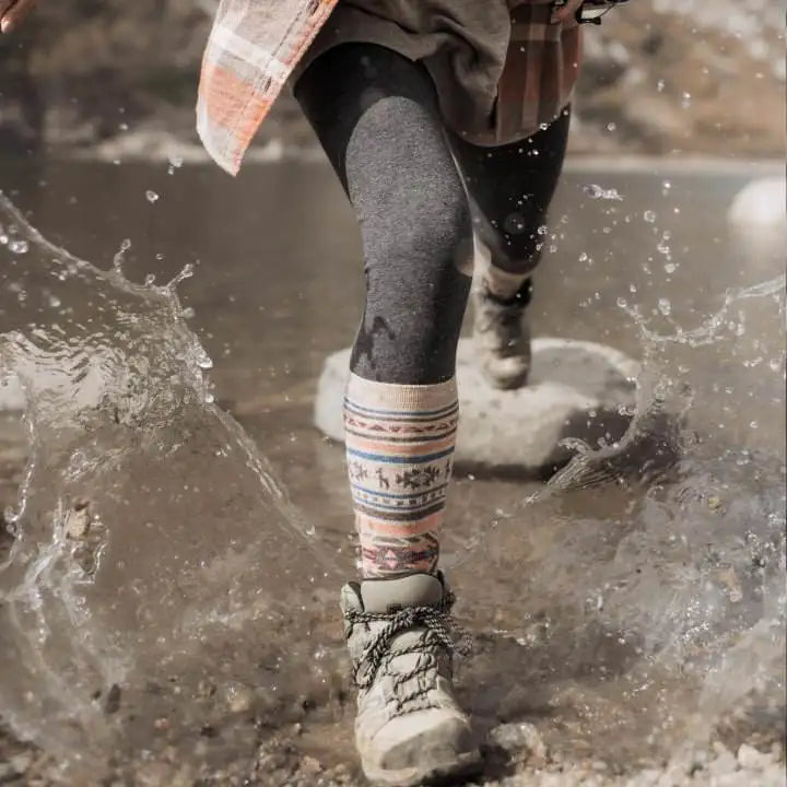 Our alpaca socks in action across a river