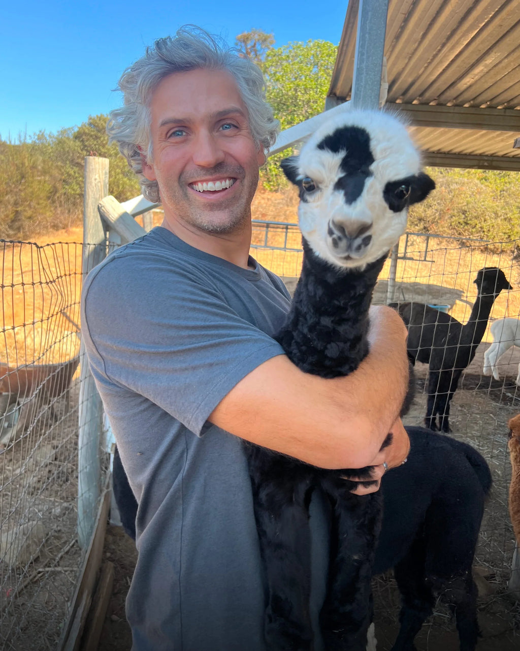 PAKA team member wearing the Essential Tee made from alpaca fiber outdoors