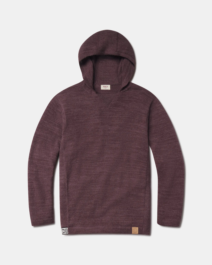 Front view of The Hoodie alpaca wool pullover with hood in raisin, showing knit texture and front hem logo on white background