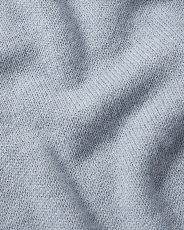 Close-up of The Original Crew alpaca crewneck in sky blue showing soft knit texture and alpaca fiber