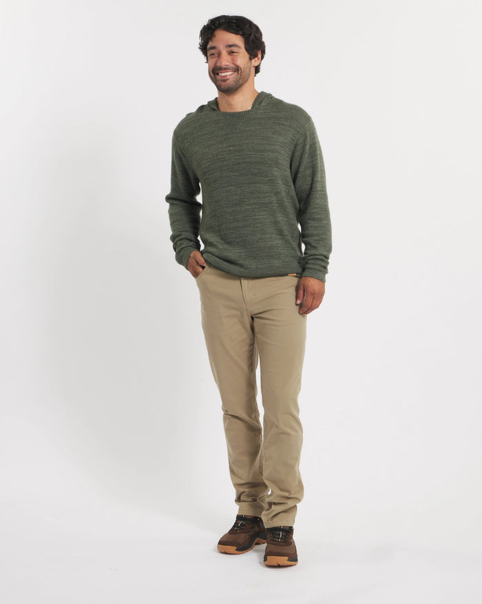 Front view of The Hoodie alpaca wool hoodie in Eucalyptus on model showing relaxed fit against white background
