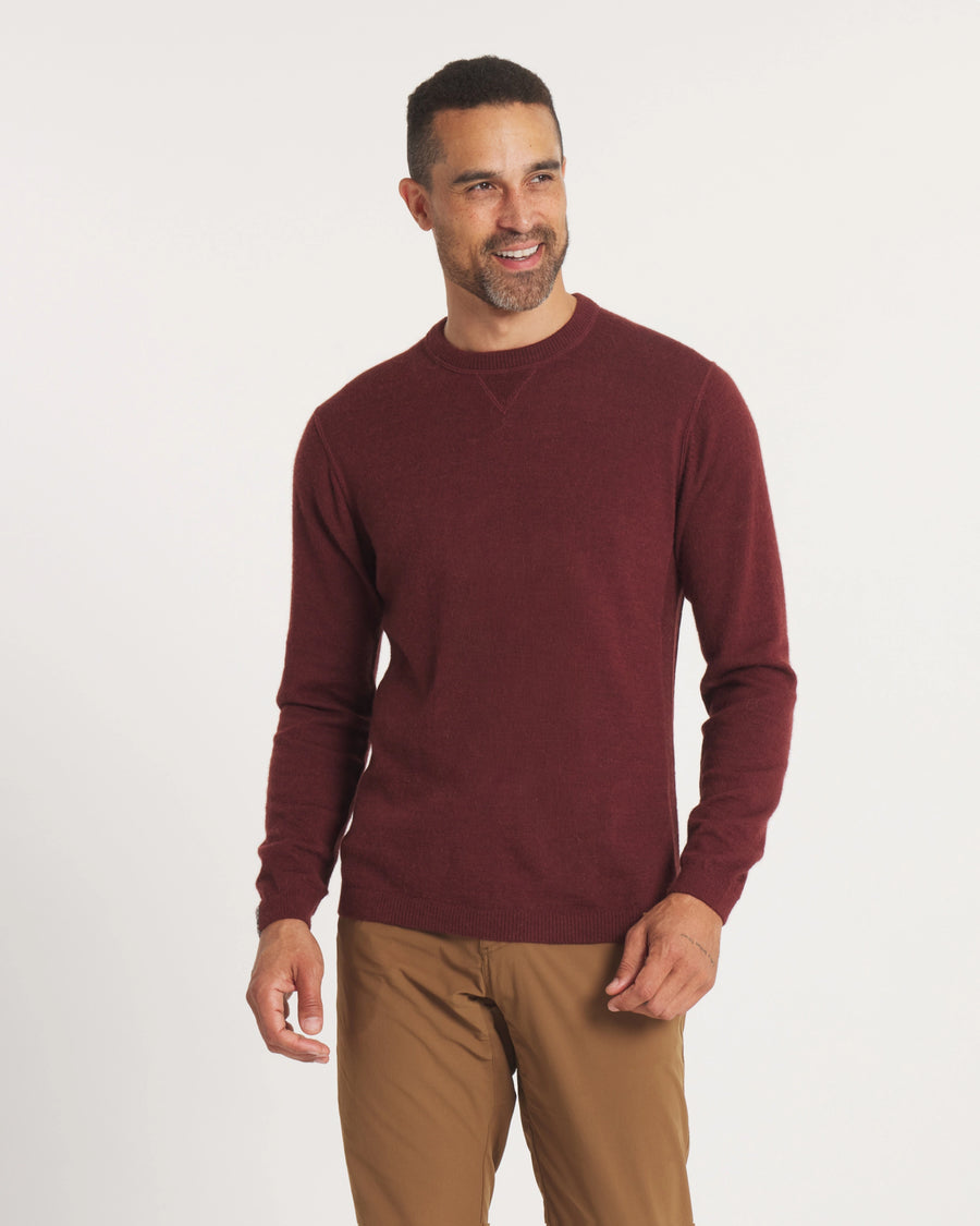 Front view of The Lightweight Crew burgundy alpaca-blend crewneck on model showcasing relaxed fit and long sleeves on white background