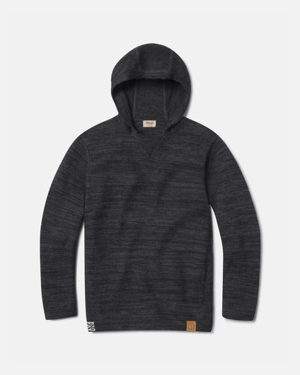 Flat lay of The Hoodie alpaca hoodie charcoal, knit texture with hood, sleeves, and logo patch on white background