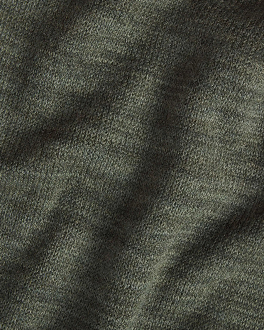 Close-up of The Hoodie alpaca hoodie showcasing eucalyptus green knit texture and soft drape