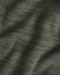 Close-up of The Hoodie alpaca hoodie showcasing eucalyptus green knit texture and soft drape