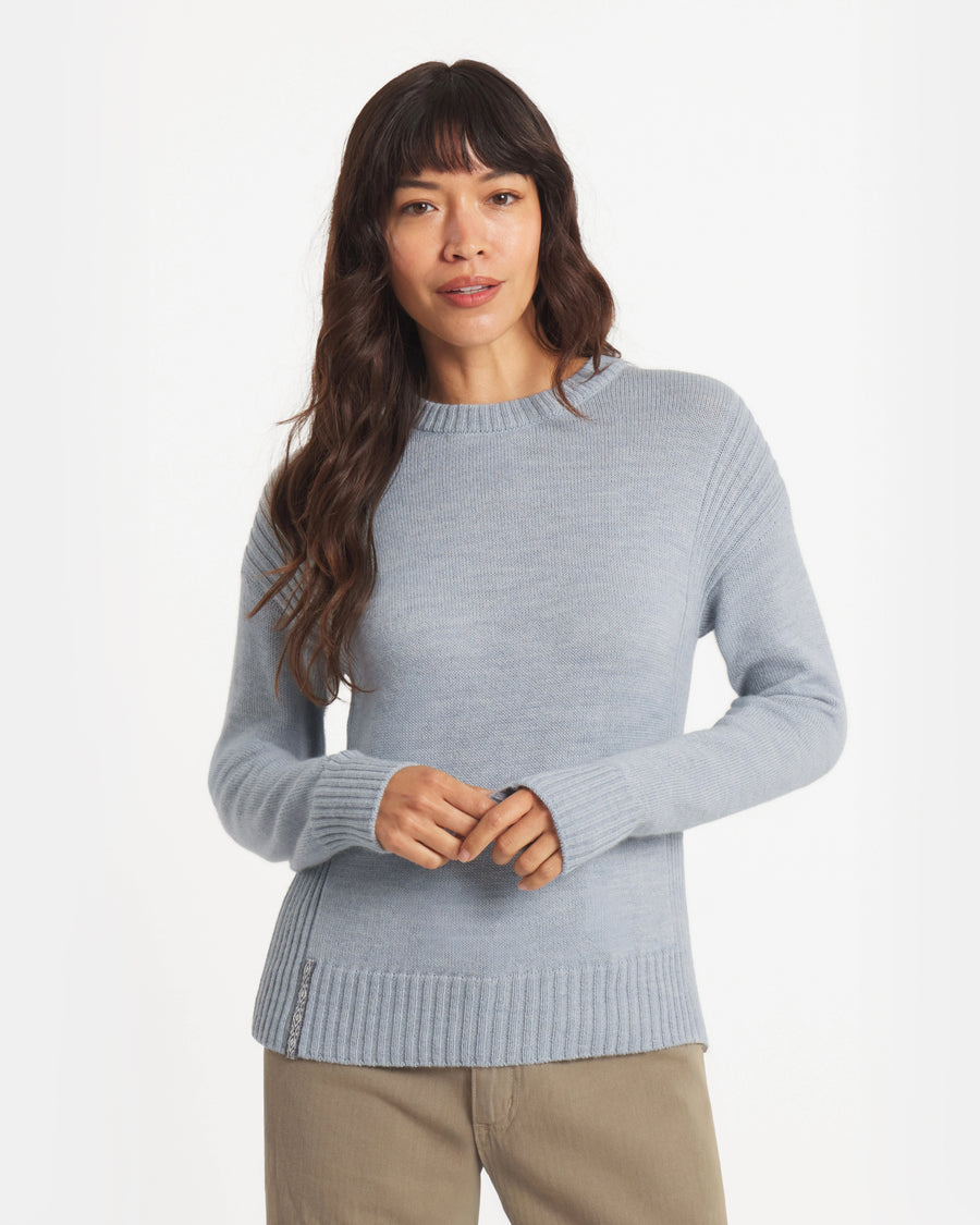 Front view of Women’s Original Crew alpaca crewneck in sky blue, ribbed cuffs and hem, relaxed fit on model, white background