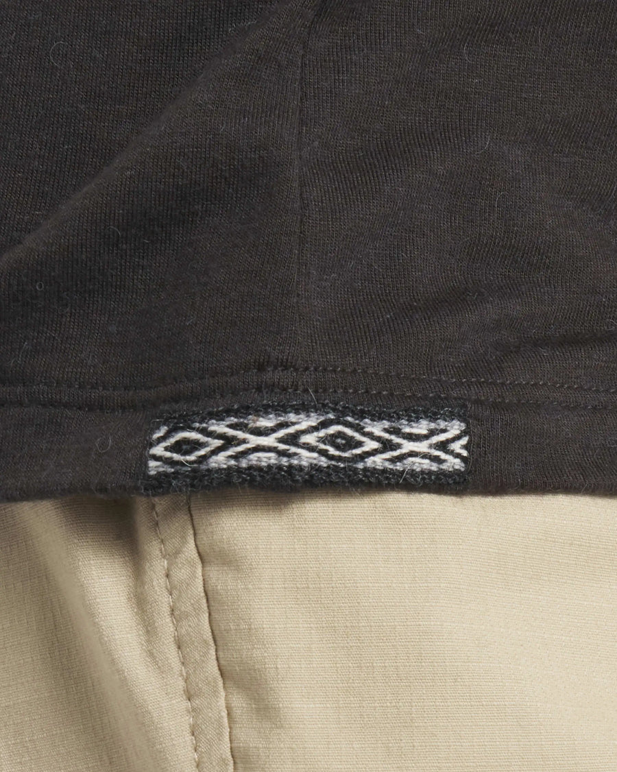 Close-Up of Inca ID on Women's Aire Alpaca Long Sleeve Hiking Shirt in Black – PAKA Apparel