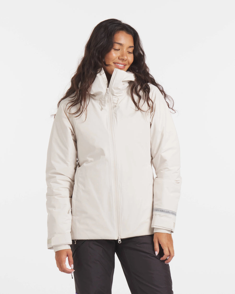 Front view of Women’s Apu Parka in ivory, showing funnel collar, full zipper, and cuff trim on white background