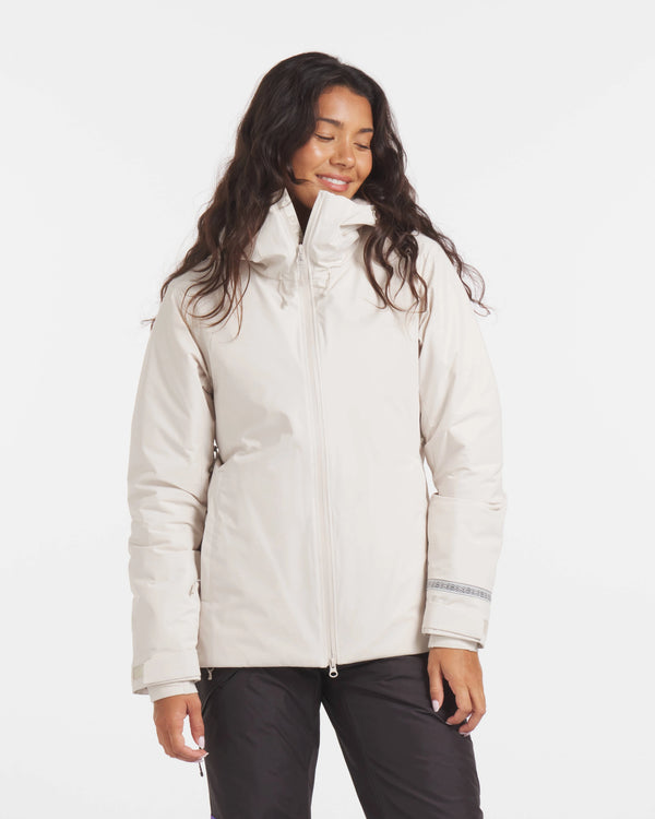 Front view of Women’s Apu Parka in ivory, showing funnel collar, full zipper, and cuff trim on white background