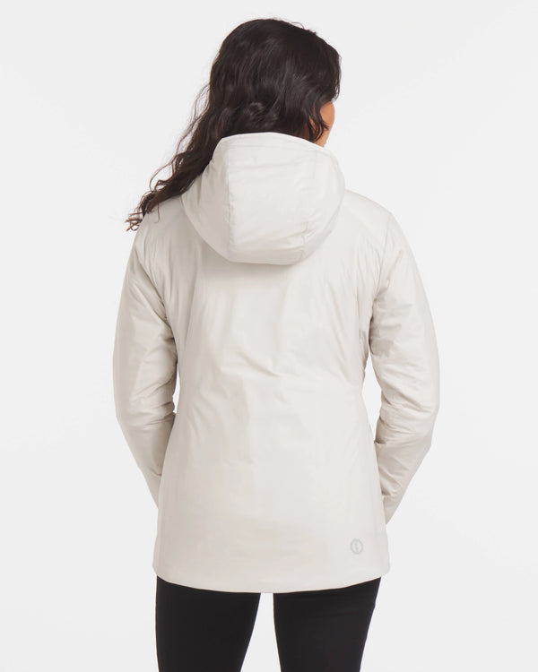 Back view of Women’s Apu Parka in ivory showing hood and mid-thigh length on model against white background