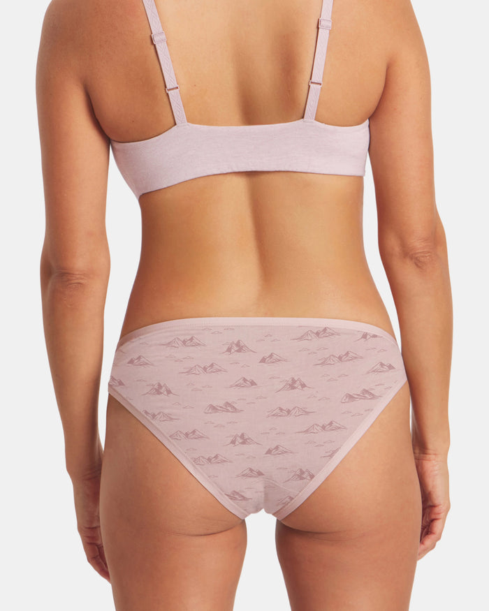 Back view of Essential Printed Bikini Brief in Smokey Lavender showing mountain print and mid-rise fit on model
