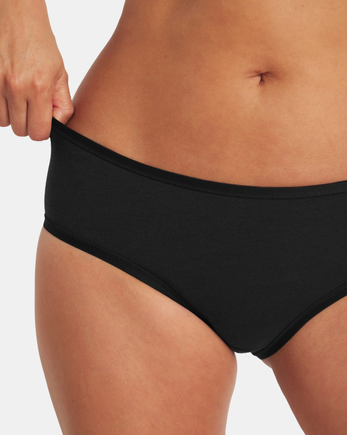 Front close up of Women’s Essential mid-rise brief in black, mid-rise fit with stretch waistband on light gray background