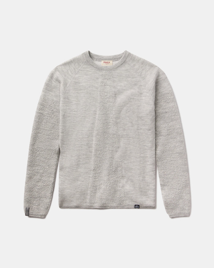 Front view of Women’s Mountain Crew sweater showcasing heather grey textured knit and crew neckline on light gray background