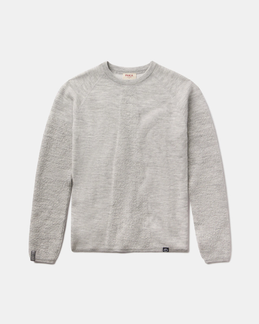 Front view of Women’s Mountain Crew sweater showcasing heather grey textured knit and crew neckline on light gray background
