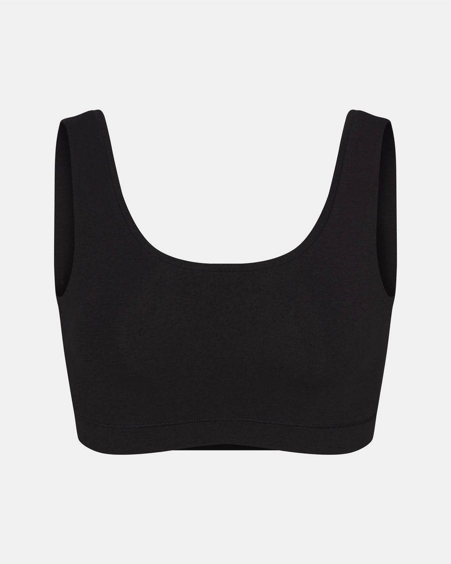 Front view of Women’s Essential Scoop Bralette in black showcasing scoop neckline and wide straps on light gray background