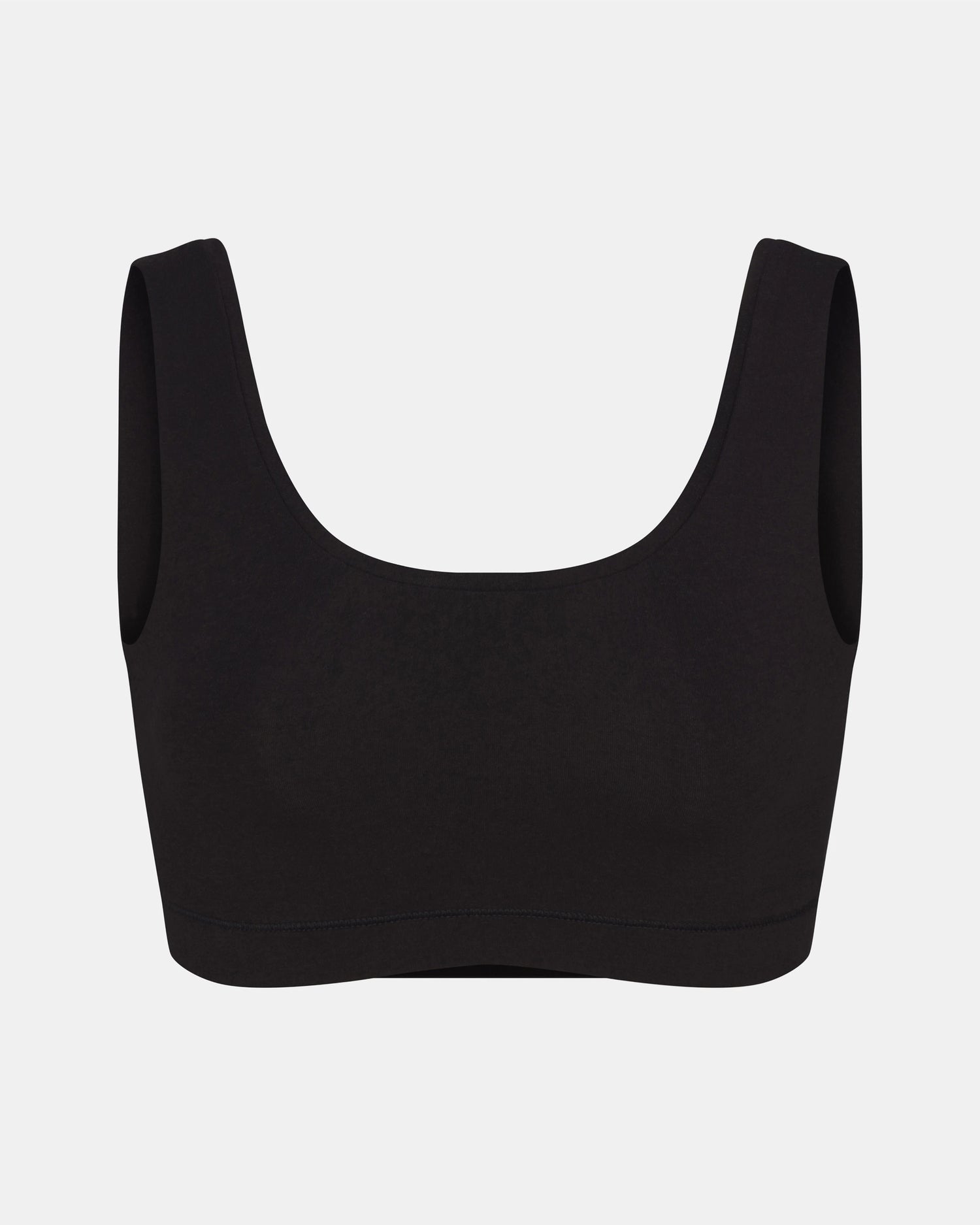 Front view of Women’s Essential Scoop Bralette in black showcasing scoop neckline and wide straps on light gray background