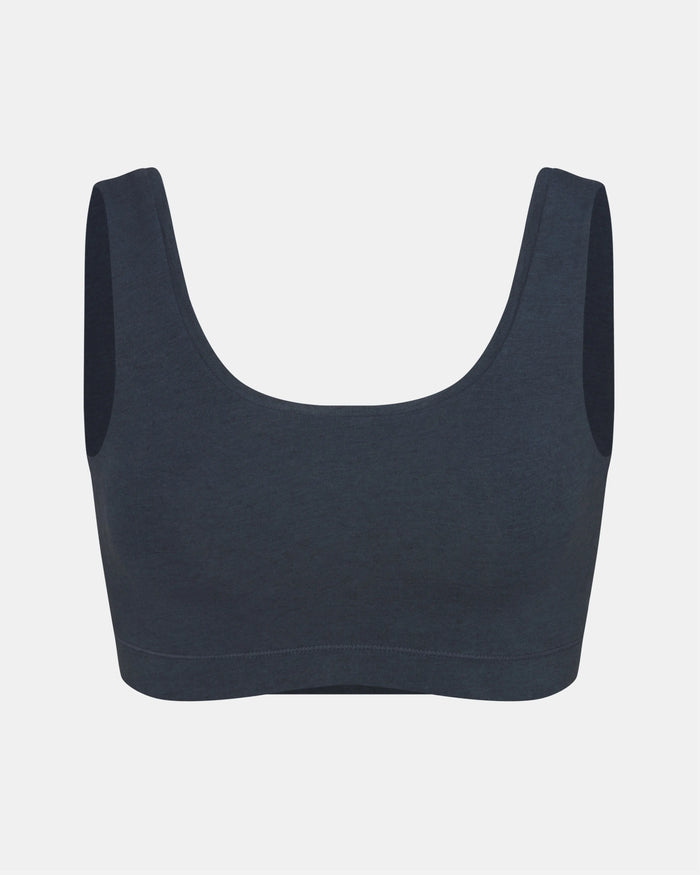 Front view of Women’s Essential Scoop Bralette in navy showing scoop neckline, wide straps and elastic underband on light gray