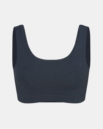 Front view of Women’s Essential Scoop Bralette in navy showing scoop neckline, wide straps and elastic underband on light gray