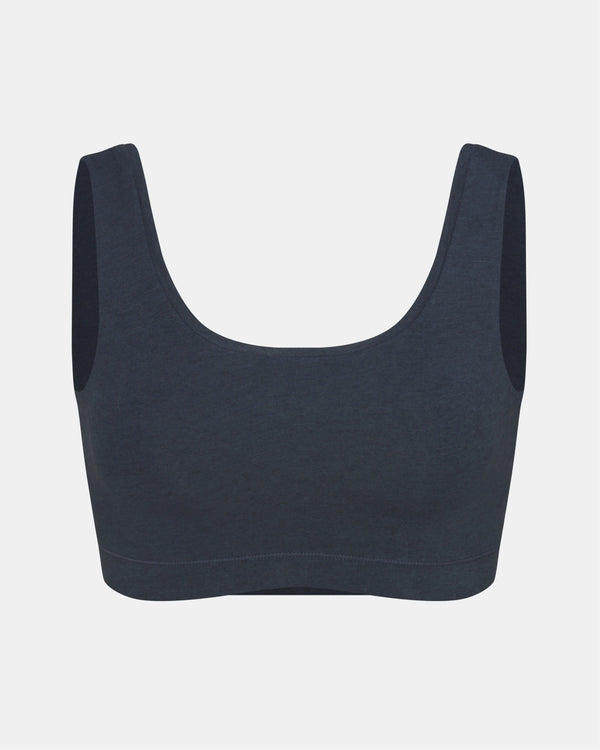 Front view of Women’s Essential Scoop Bralette in navy showing scoop neckline, wide straps and elastic underband on light gray