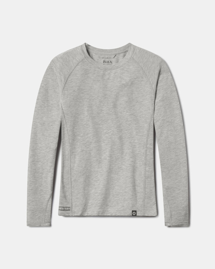 Flat-lay of Women’s Sol Crew sun shirt in heather grey alpaca with crewneck and raglan sleeves on white background