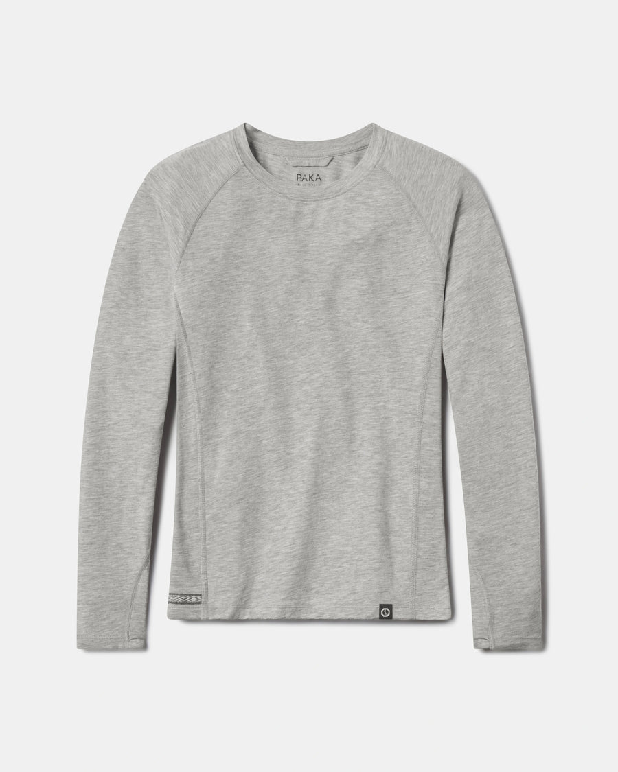 Flat-lay of Women’s Sol Crew sun shirt in heather grey alpaca with crewneck and raglan sleeves on white background