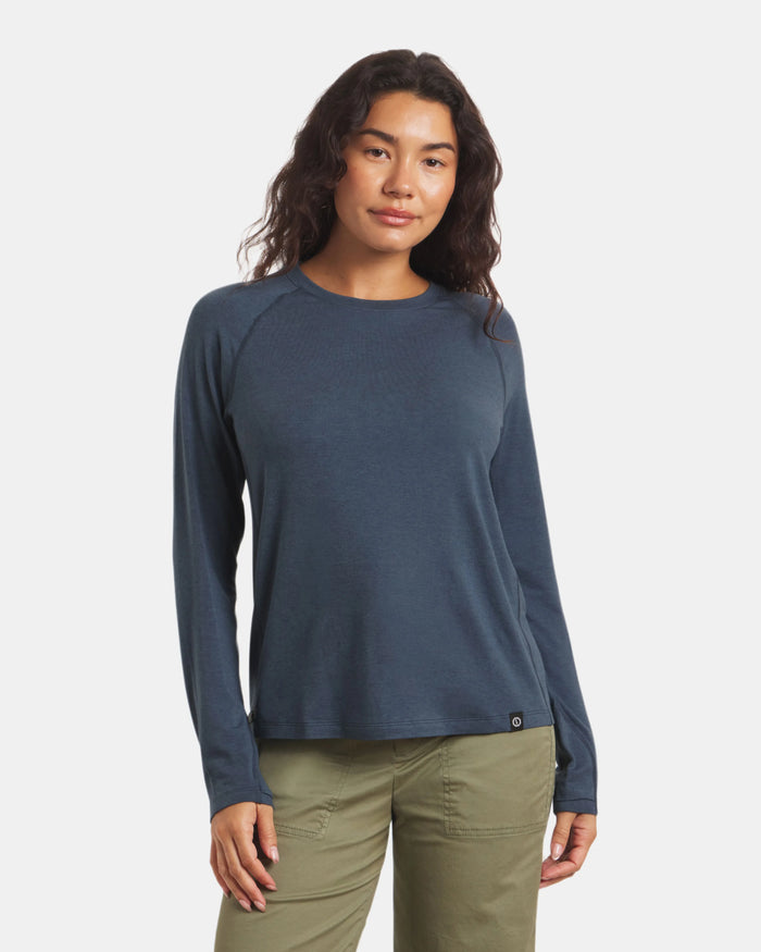 Front view of Women’s Sol Crew sun-protection shirt in navy on model, relaxed fit with crew neckline and raglan sleeves