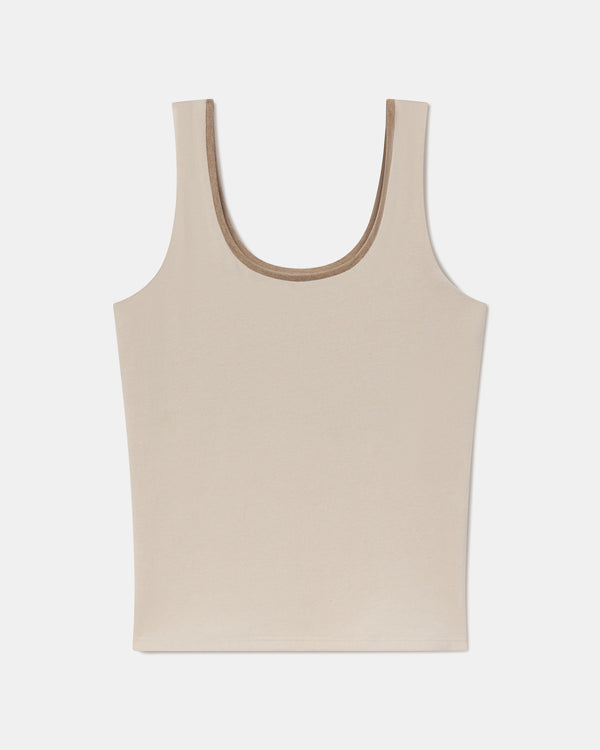 Flat lay of Women’s Essential Tank showing scoop neckline and built-in shelf bra in birch on white background