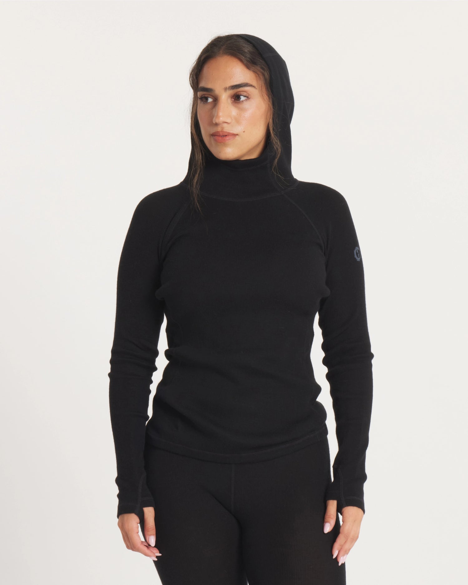 Woman with Hood Up on Black Thermal Hoodie Ski Baselayer – PAKA Apparel