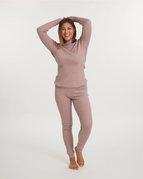 Front view of Women’s Thermal Hoodie in magnolia pink on model showing slim hooded long-sleeve fit on white background