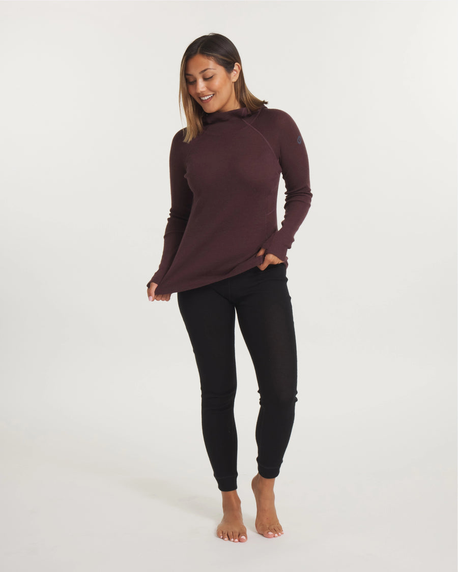 Three-quarter front of Women’s Thermal Hoodie in burgundy on a model showing hood, fitted shape and thumbhole cuffs