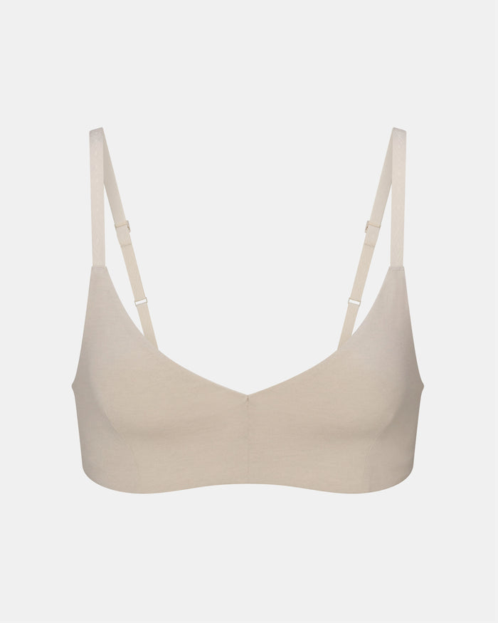 Front view of Women’s Essential Triangle Bralette in bone showing triangle cups and adjustable straps on pale gray background