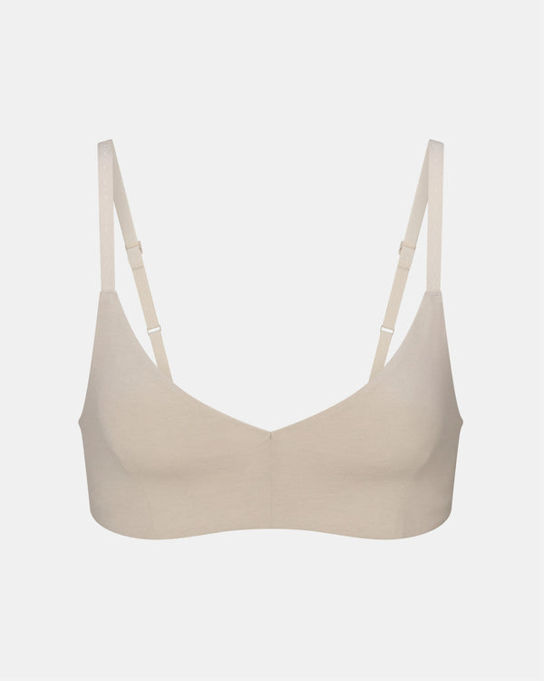 Front view of Women’s Essential Triangle Bralette in bone showing triangle cups and adjustable straps on pale gray background