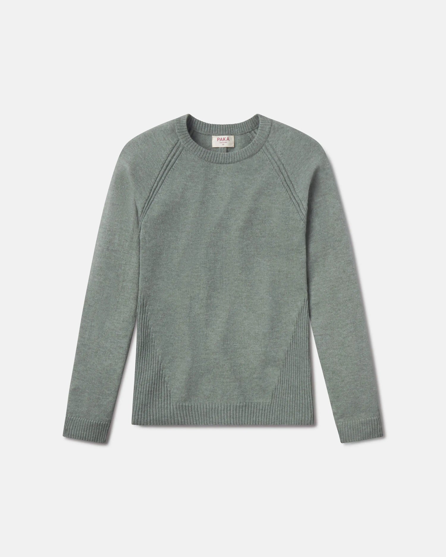 Green sweater on a light gray background