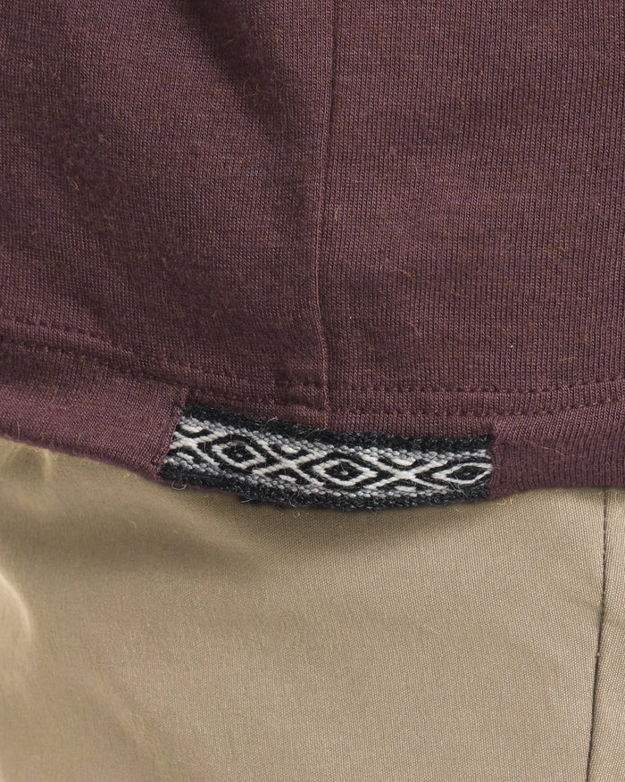 Close-Up of Inca ID on Women's Aire Alpaca Long Sleeve Shirt in Fig / Purple – PAKA Apparel