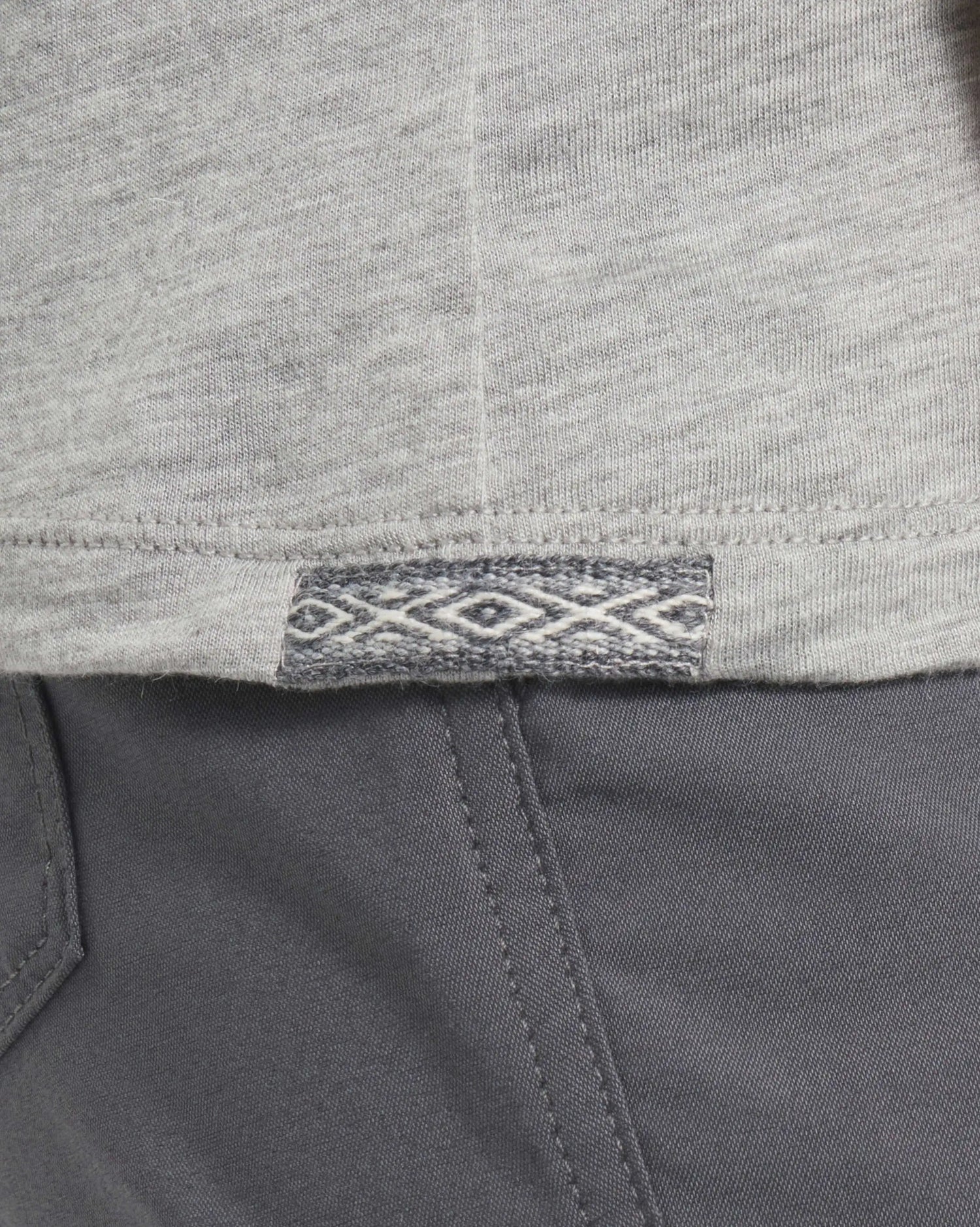 Close-Up of Inca ID on Heather Grey Women's Aire Long Sleeve Shirt for Hiking and Outdoors – PAKA Apparel