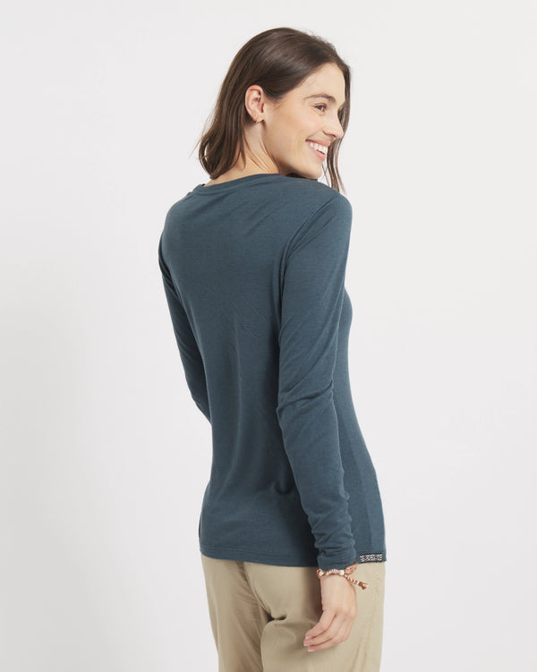Three-quarter back view of Women’s Aire Long Sleeve shirt in navy showing slim fit and long sleeves on a light background