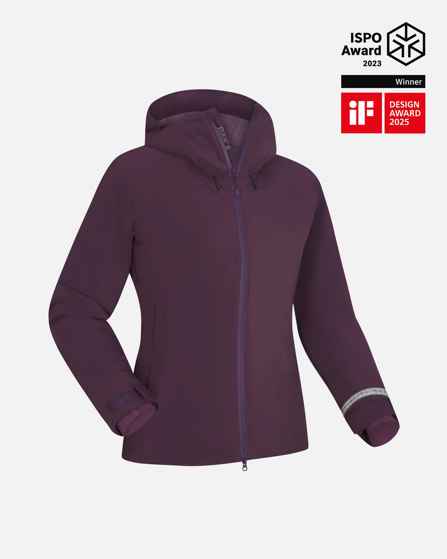Front three-quarter view of Women’s Apu Parka in amethyst, hooded waterproof shell with full zipper and visible award badges