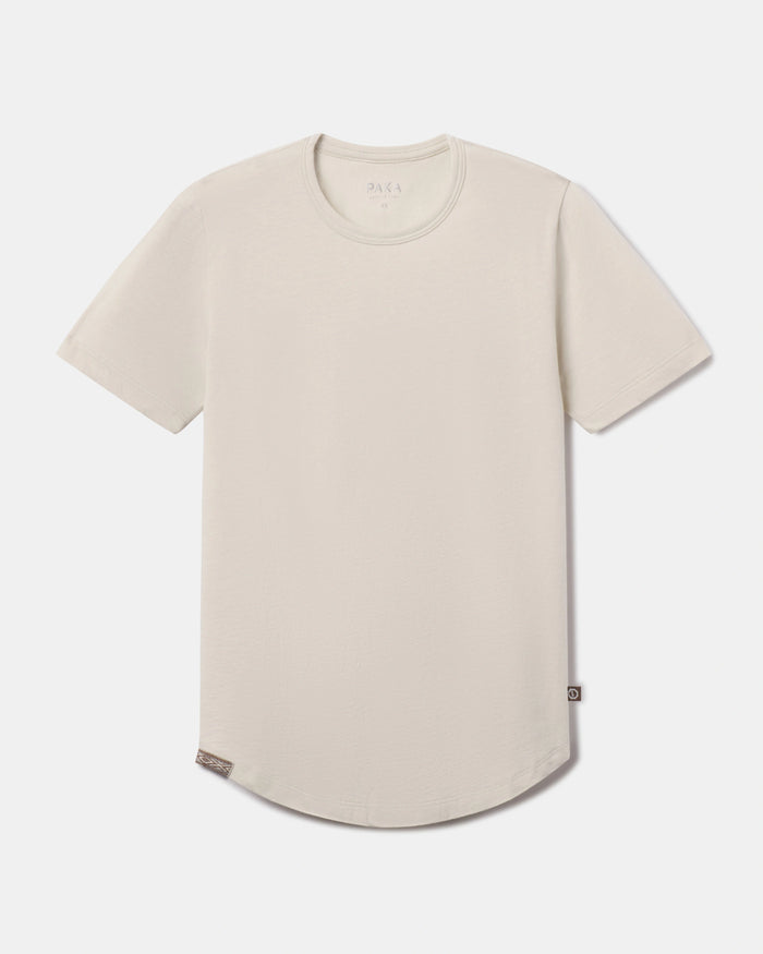 Front flat lay of Women’s Essential Tee in Bone showcasing crewneck, short sleeves, and curved hem on light background
