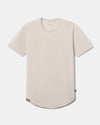 Front flat lay of Women’s Essential Tee in Bone showcasing crewneck, short sleeves, and curved hem on light background