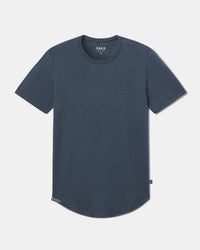 Front flat-lay of Women’s Essential Tee, navy, showing crewneck, short sleeves, ribbed neckline and curved hem on light gray background