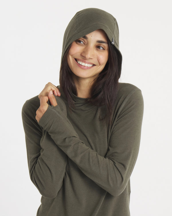 Front view of Women’s Sol lightweight UPF sun hoodie in Andean Moss with hood up and thumbholes on white background
