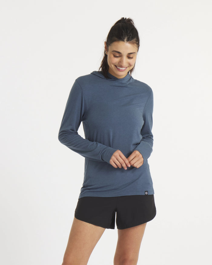 Model Smiling in Navy Sol Women's Lightweight Alpaca Sun Hoodie – PAKA Apparel